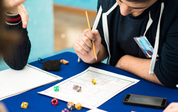 A young person playing dungeons and dragons