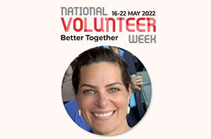 A picture of a volunteer next to the National Volunteer Week logo.
