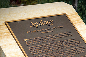 A photo of the forced adoption apology plaque in Queensland