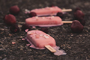 A photo of melting pink ice creams on the road