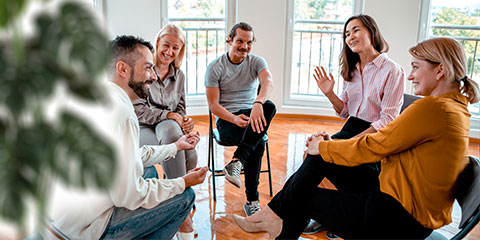 A group of people attending a support group