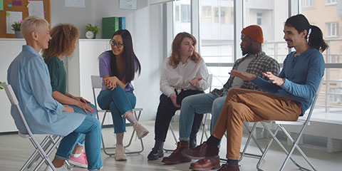 A group of people attending a support group